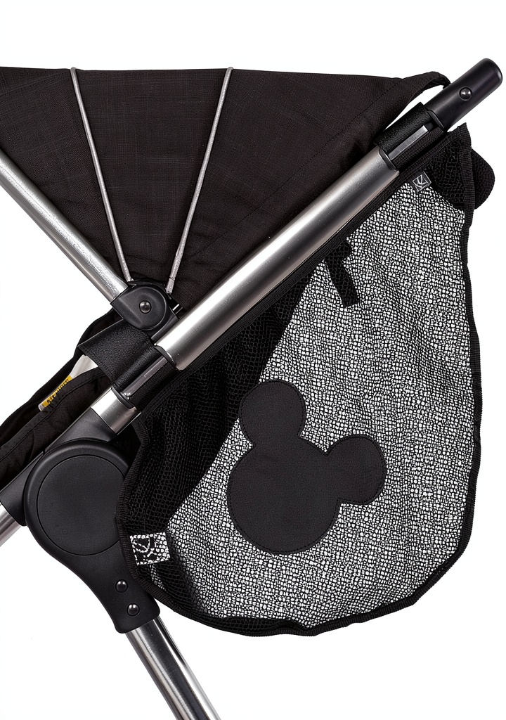J.L. Childress Disney stroller organizer attached to a stroller with items inside